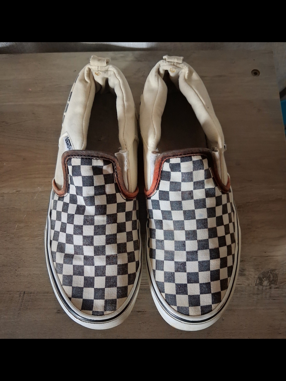 Vans Checkerboard Slip-Ons in Black and White with Tan Trim